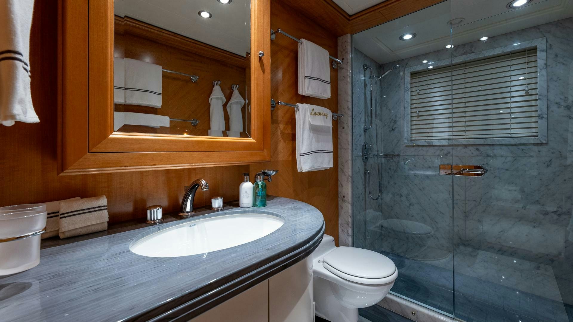 a bathroom with a glass shower aboard AMANTI Yacht for Sale