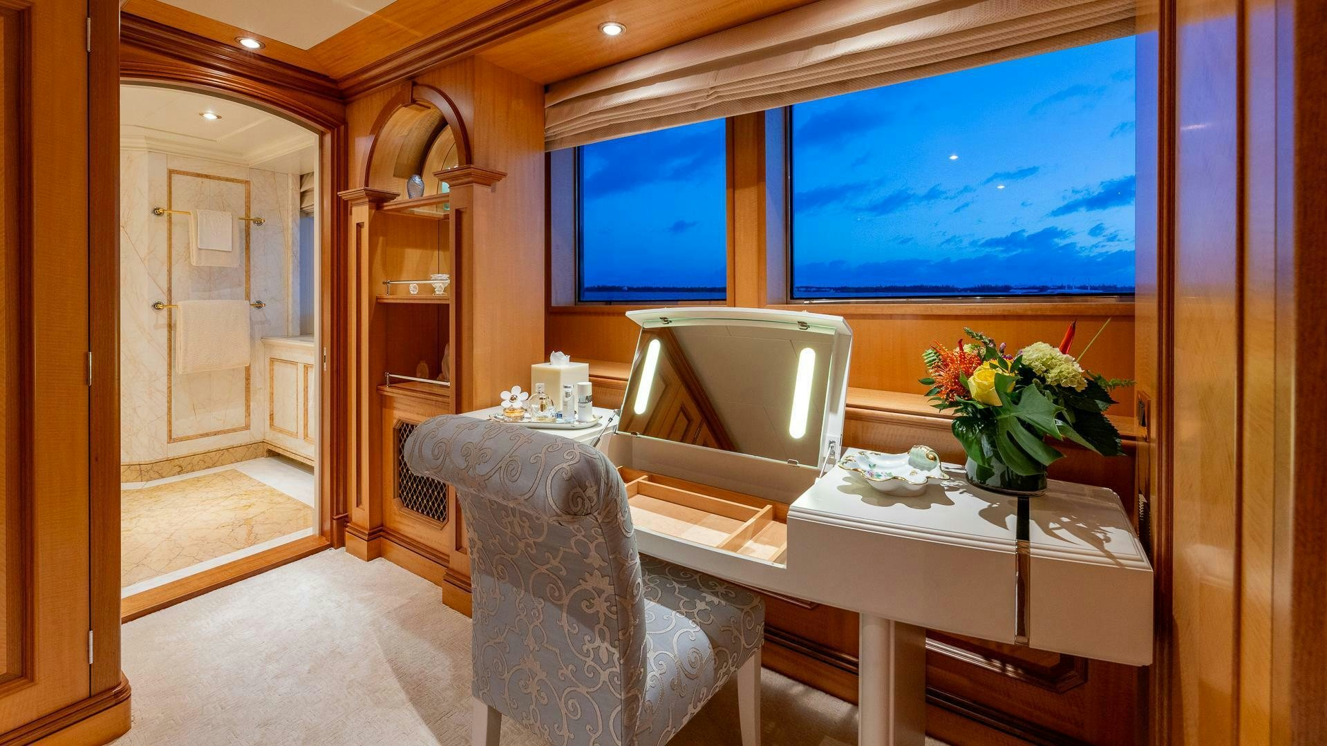 a room with a table and chairs aboard AMANTI Yacht for Sale