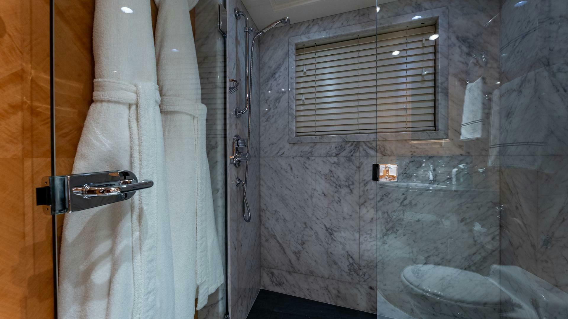 a room with a door and a window aboard AMANTI Yacht for Sale