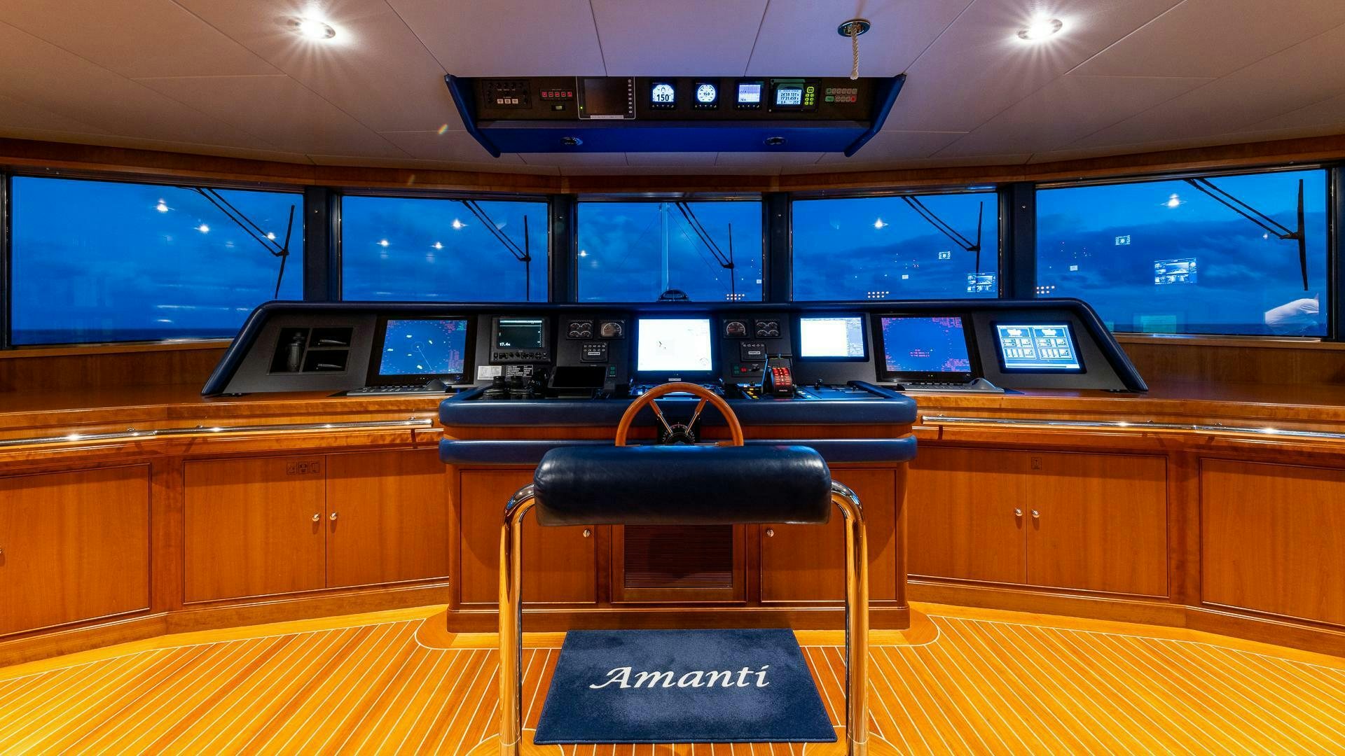 a black chair in a room aboard AMANTI Yacht for Sale