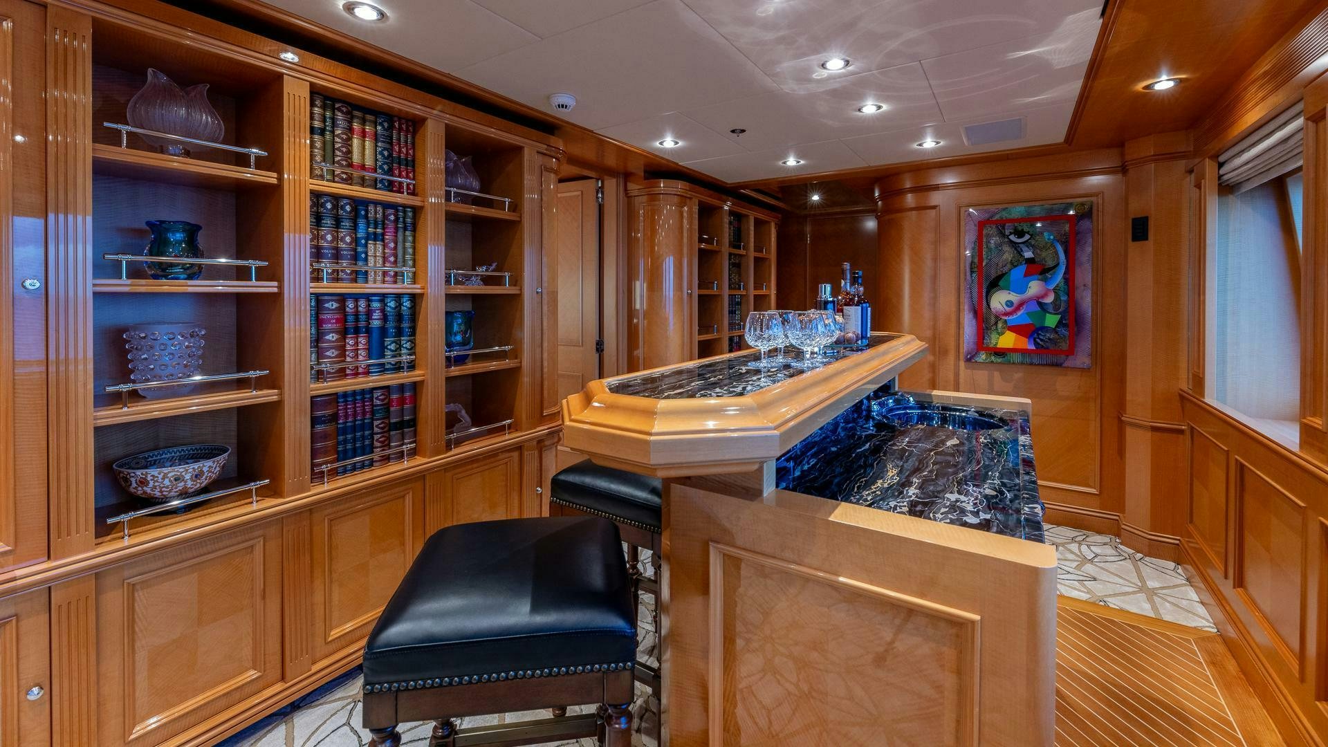 a kitchen with a large island aboard AMANTI Yacht for Sale