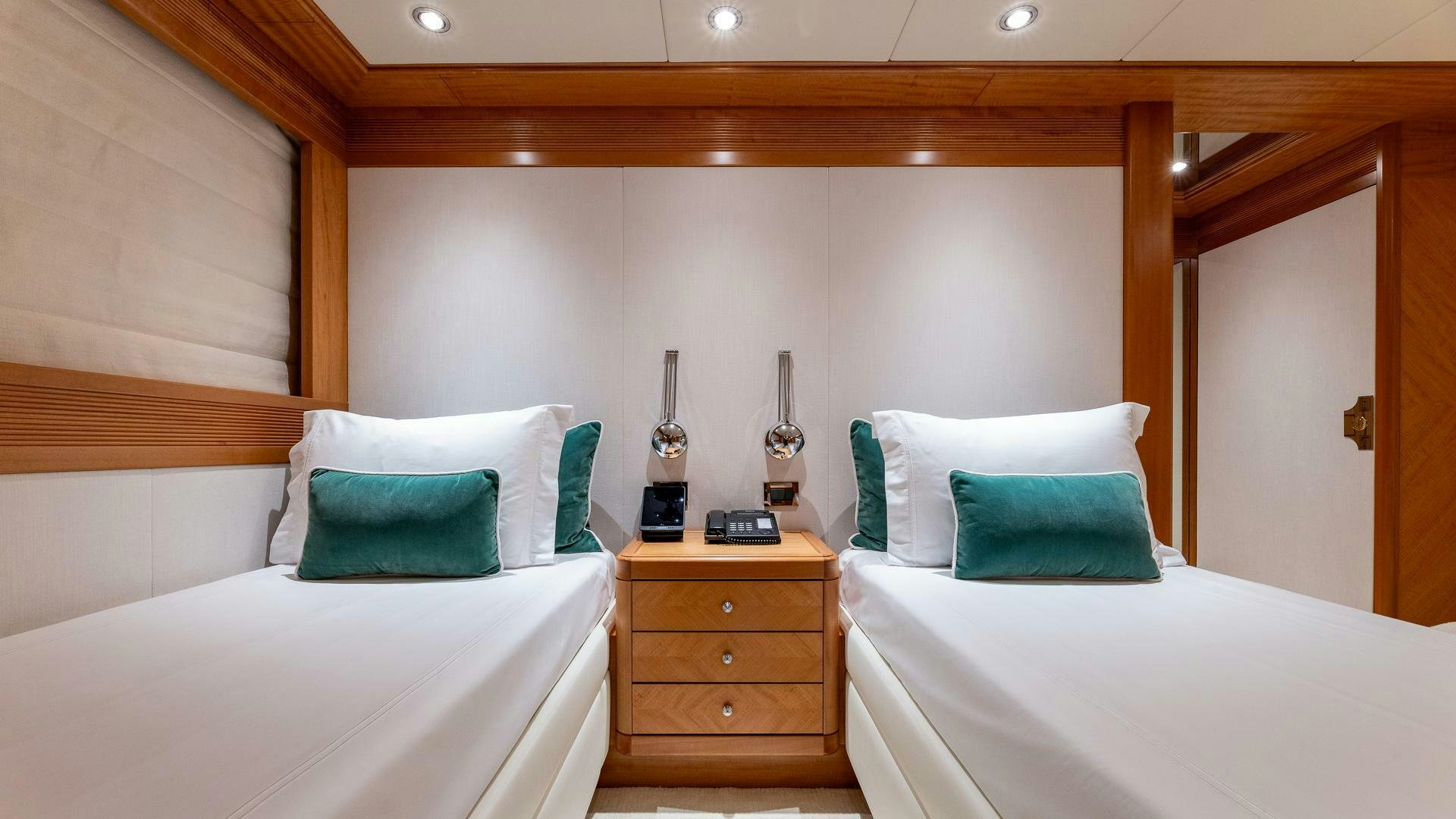 a room with two beds aboard AMANTI Yacht for Sale