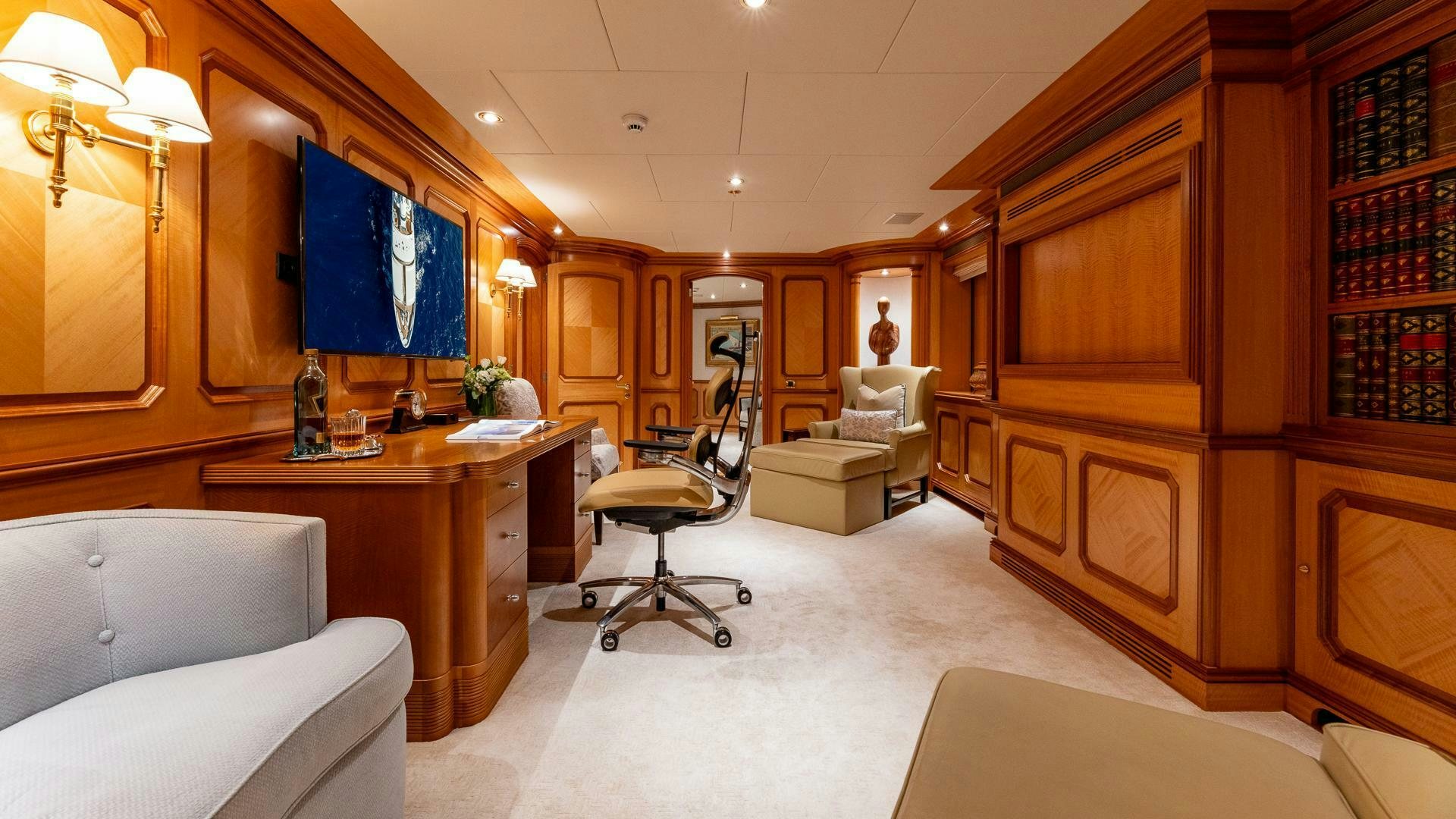 a room with a desk and a chair aboard AMANTI Yacht for Sale