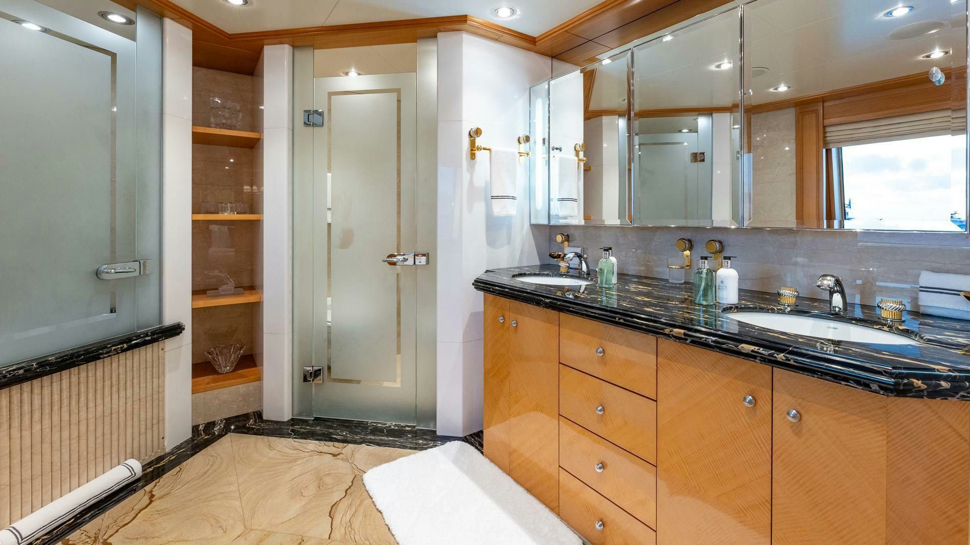 a kitchen with a countertop sink and cabinets aboard AMANTI Yacht for Sale