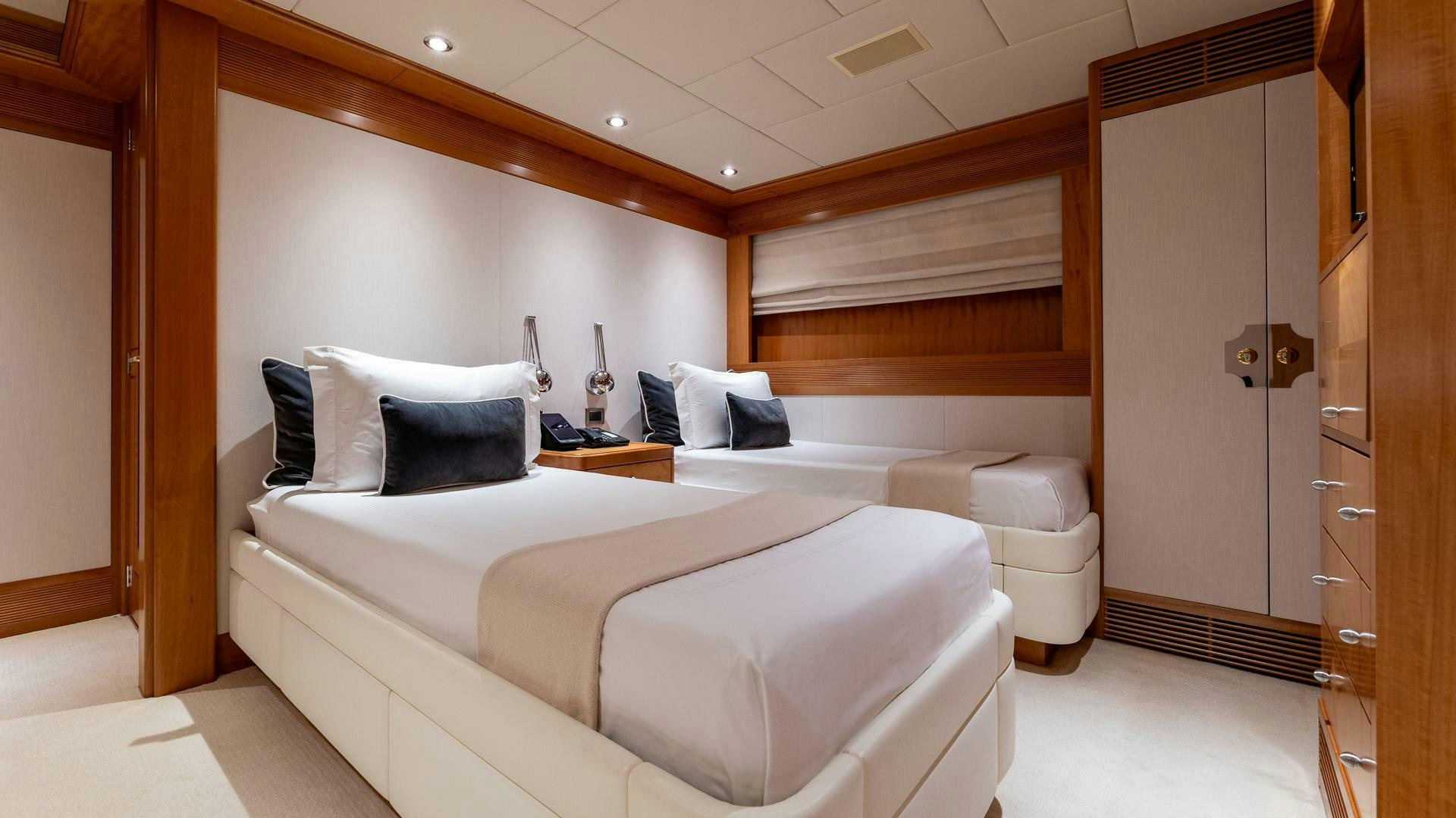 a bed in a room aboard AMANTI Yacht for Sale