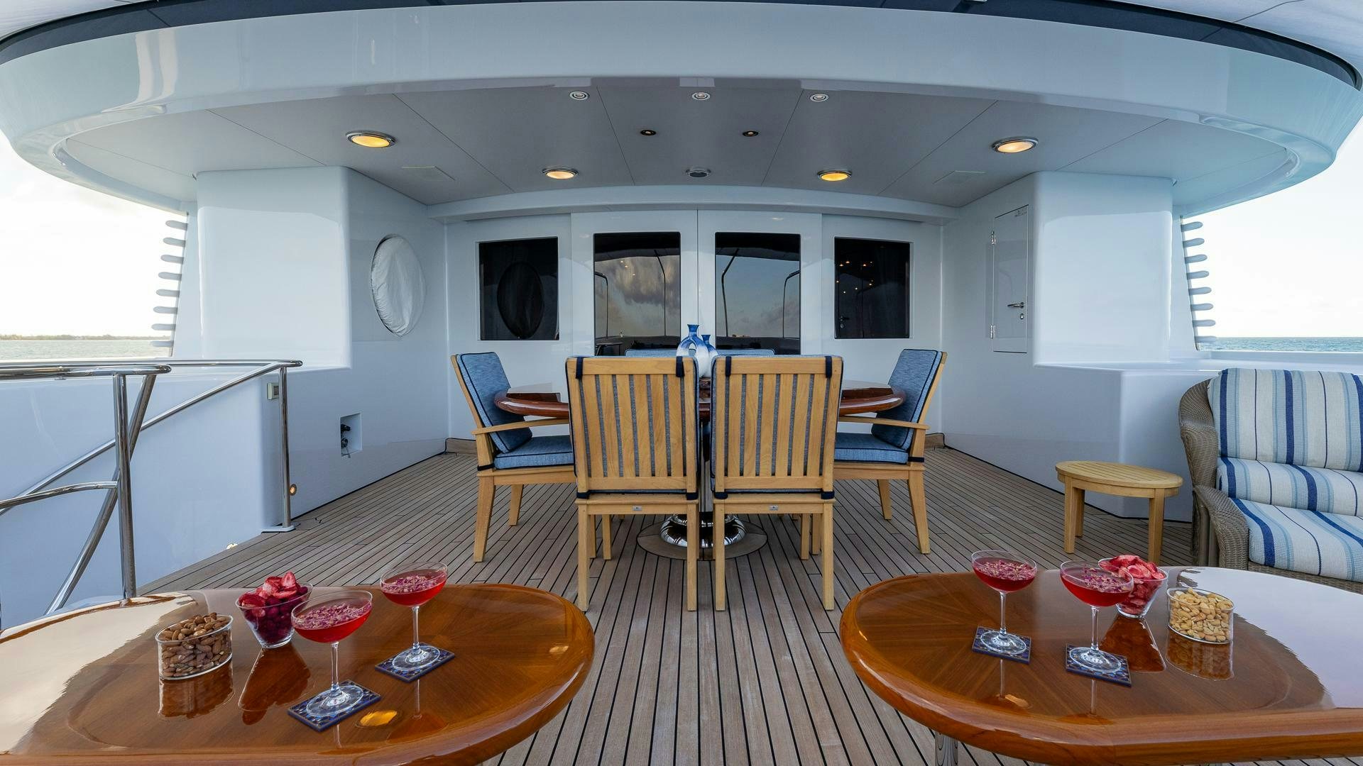 a dining room with a table and chairs aboard AMANTI Yacht for Sale