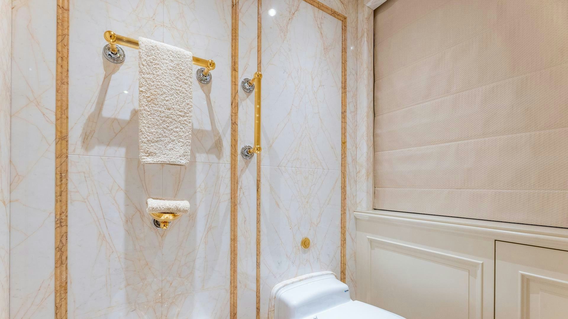 a bathroom with a towel on the wall aboard AMANTI Yacht for Sale