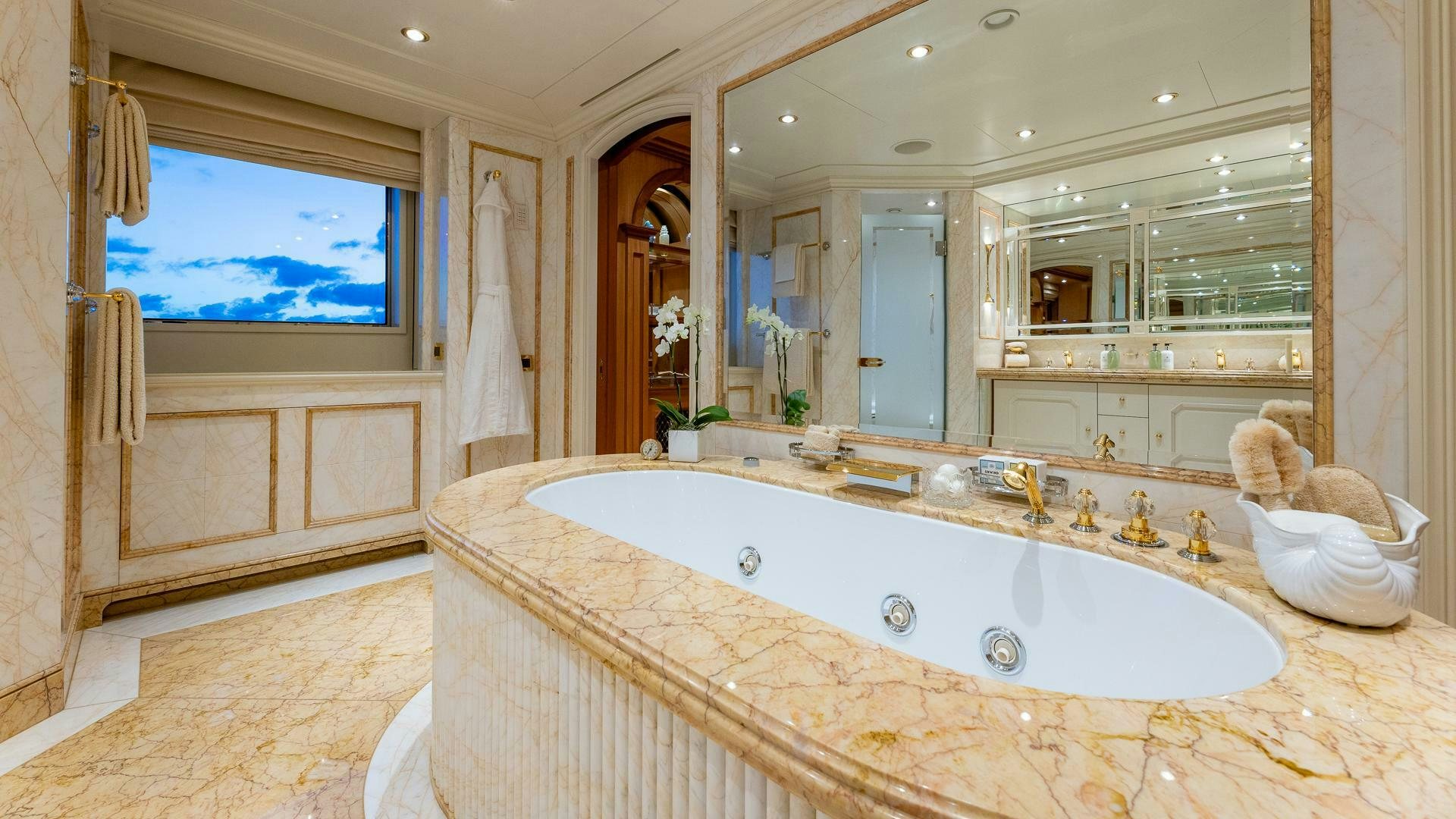 a large bathroom with a large bathtub aboard AMANTI Yacht for Sale