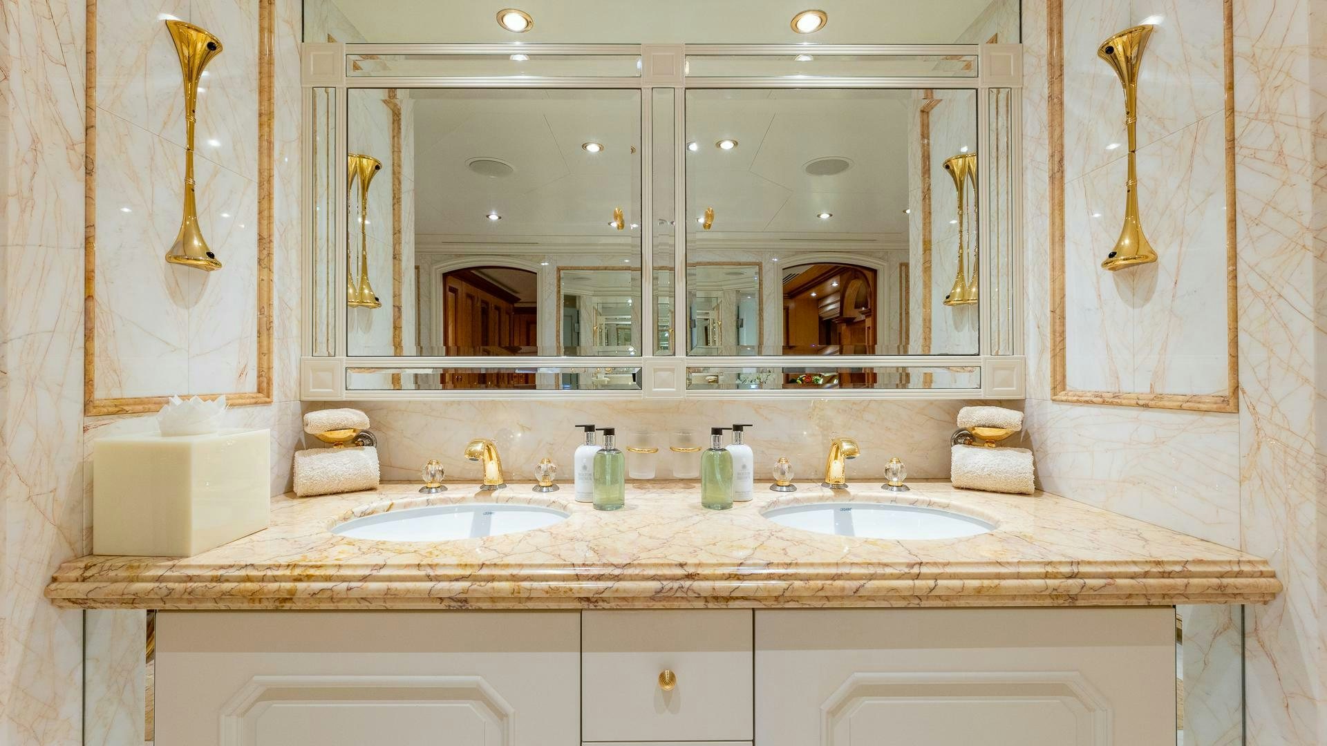 a bathroom with a large mirror aboard AMANTI Yacht for Sale
