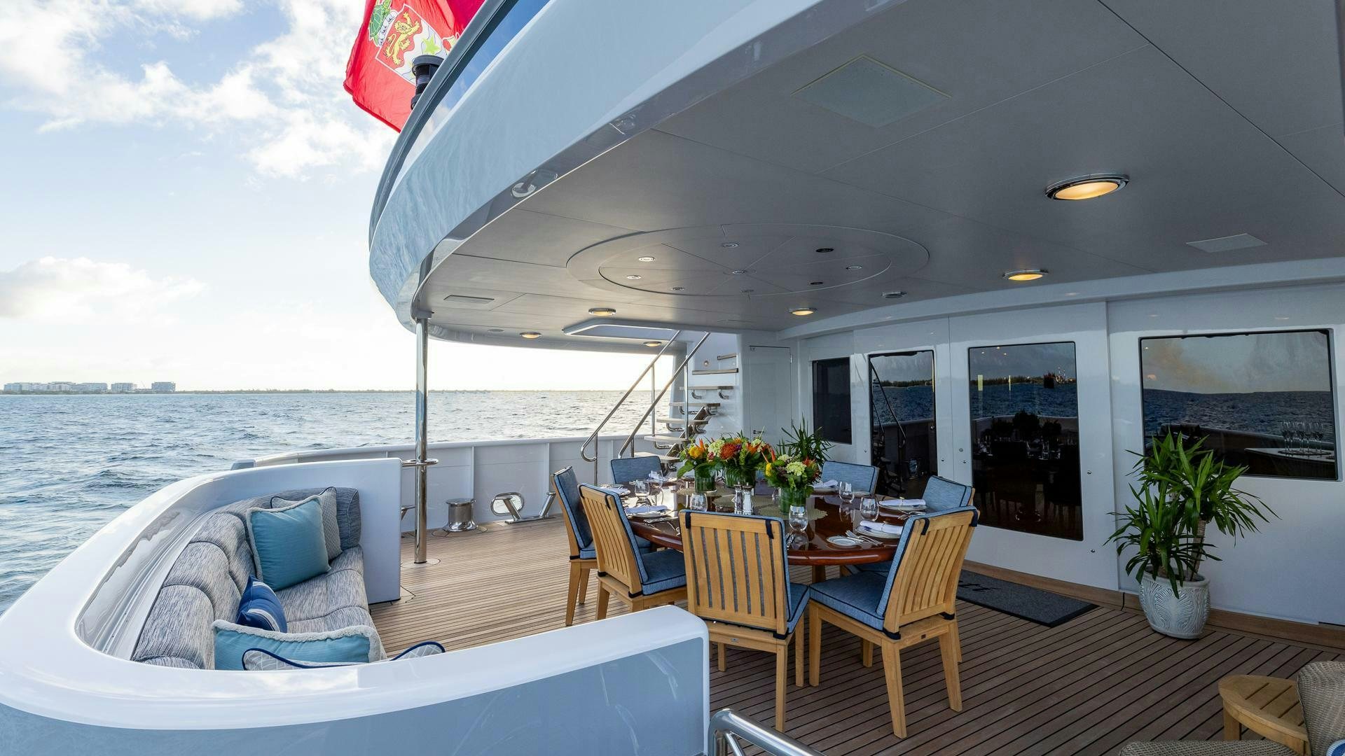 a large balcony overlooking a beach aboard AMANTI Yacht for Sale