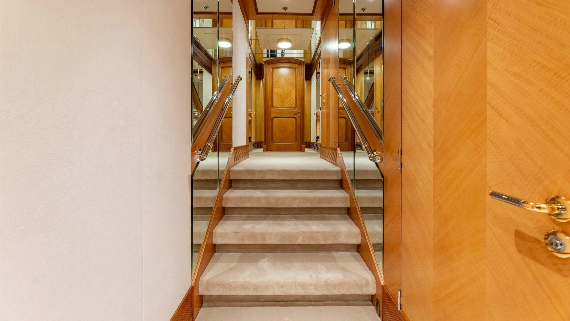 a staircase in a building aboard AMANTI Yacht for Sale