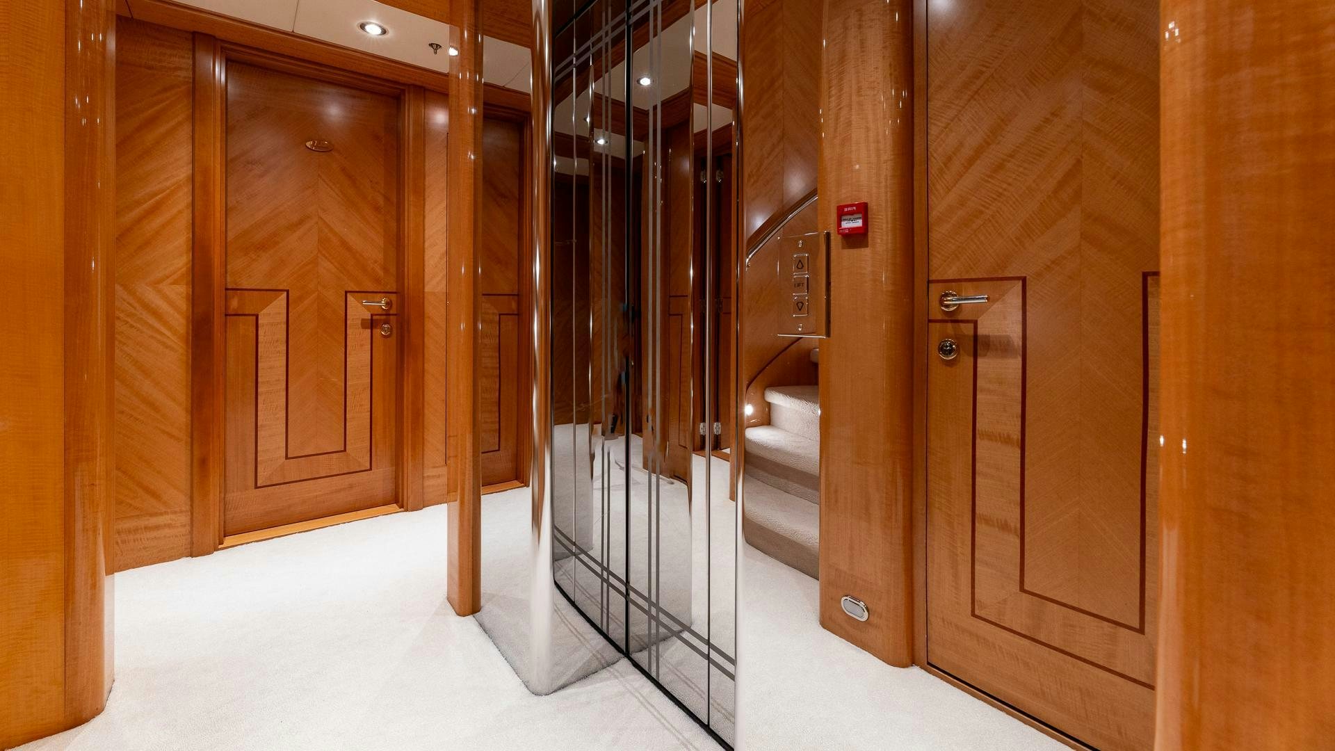 a room with wooden doors aboard AMANTI Yacht for Sale