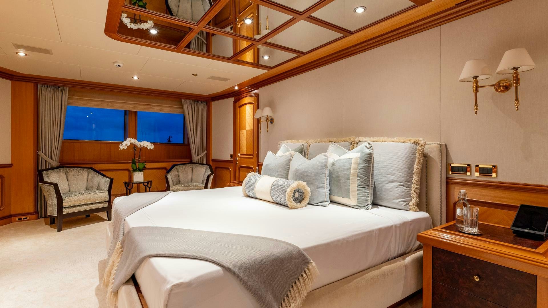 a large bedroom with a large bed aboard AMANTI Yacht for Sale