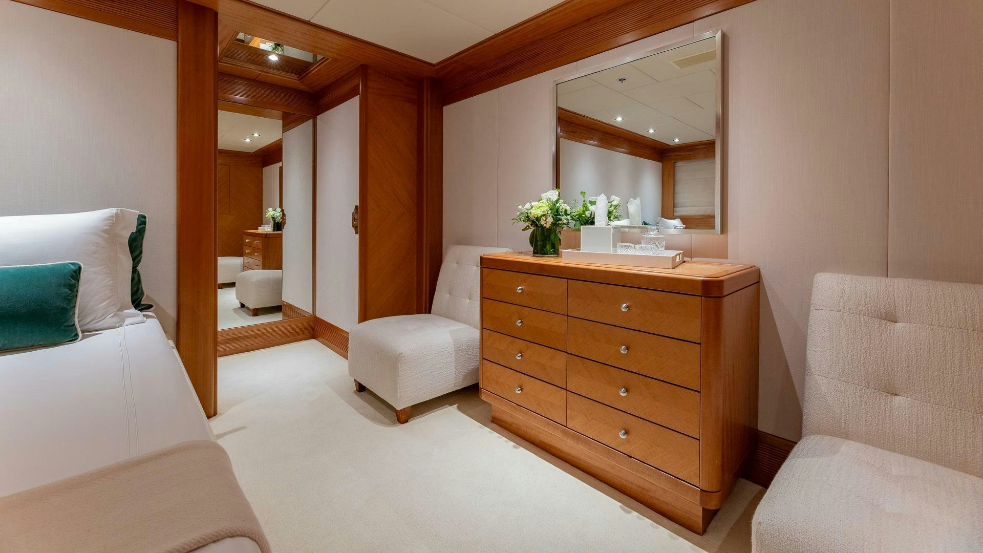 a room with a bed and a mirror aboard AMANTI Yacht for Sale