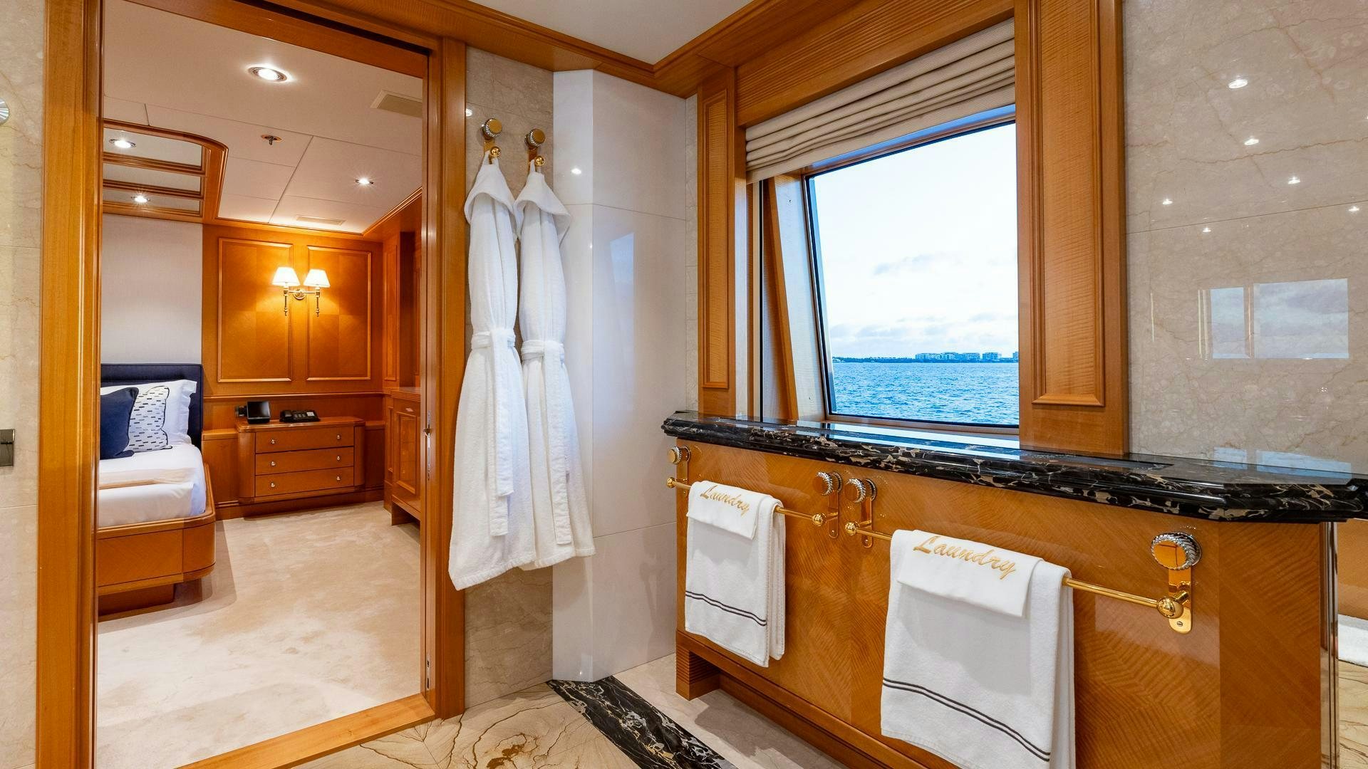 a bathroom with a sink and a mirror aboard AMANTI Yacht for Sale