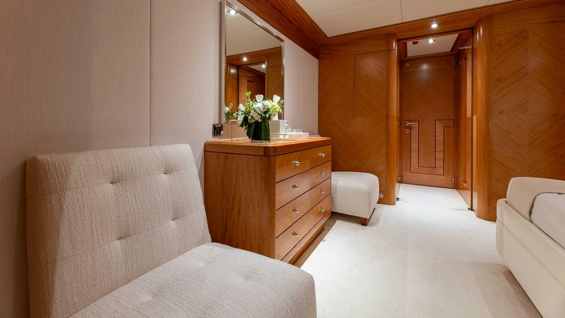a room with a bed and a mirror aboard AMANTI Yacht for Sale