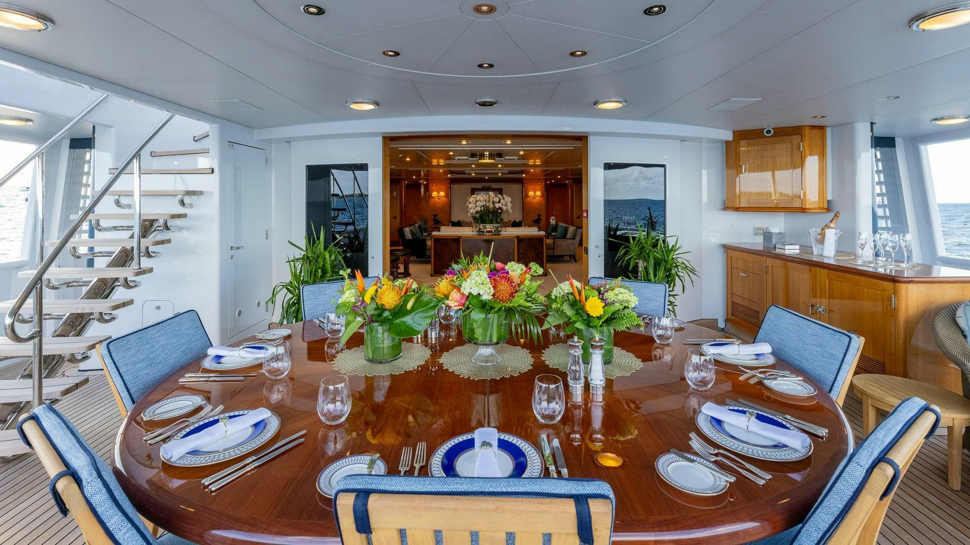 a dining room with a table and chairs aboard AMANTI Yacht for Sale