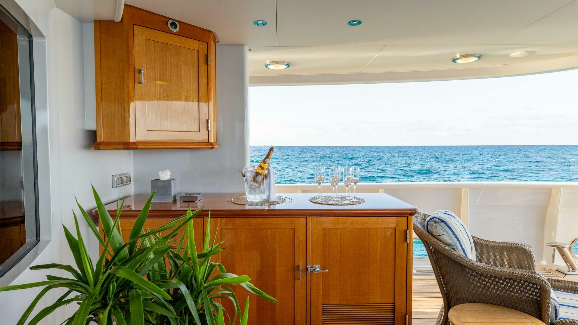 a kitchen with a table and chairs aboard AMANTI Yacht for Sale