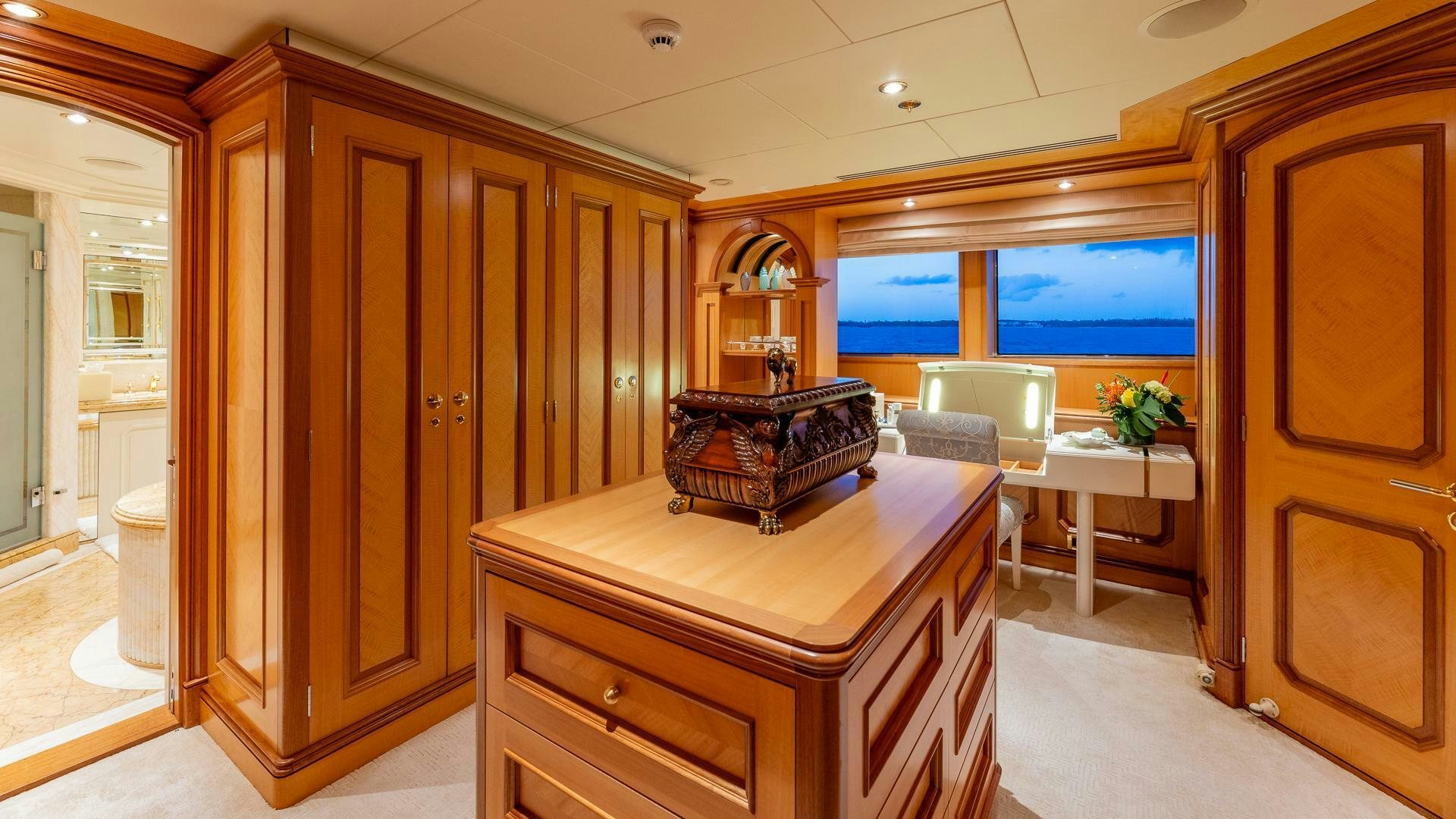 a room with a table and chairs aboard AMANTI Yacht for Sale