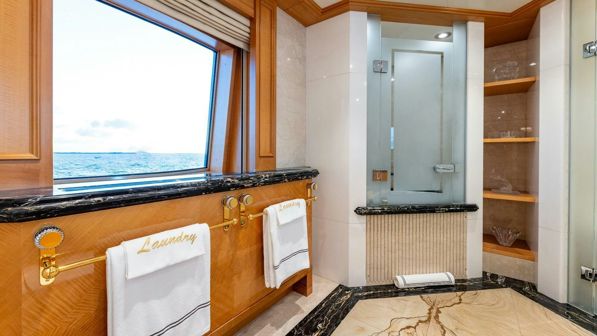 a kitchen with a large window aboard AMANTI Yacht for Sale