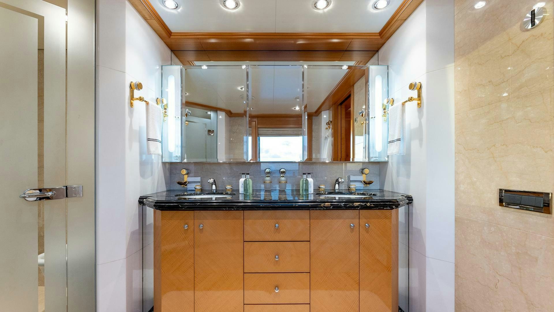 a bathroom with a sink and cabinets aboard AMANTI Yacht for Sale