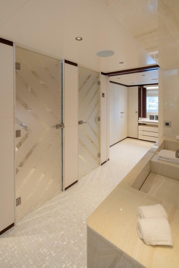 a bathroom with a large mirror aboard BOOK ENDS Yacht for Sale