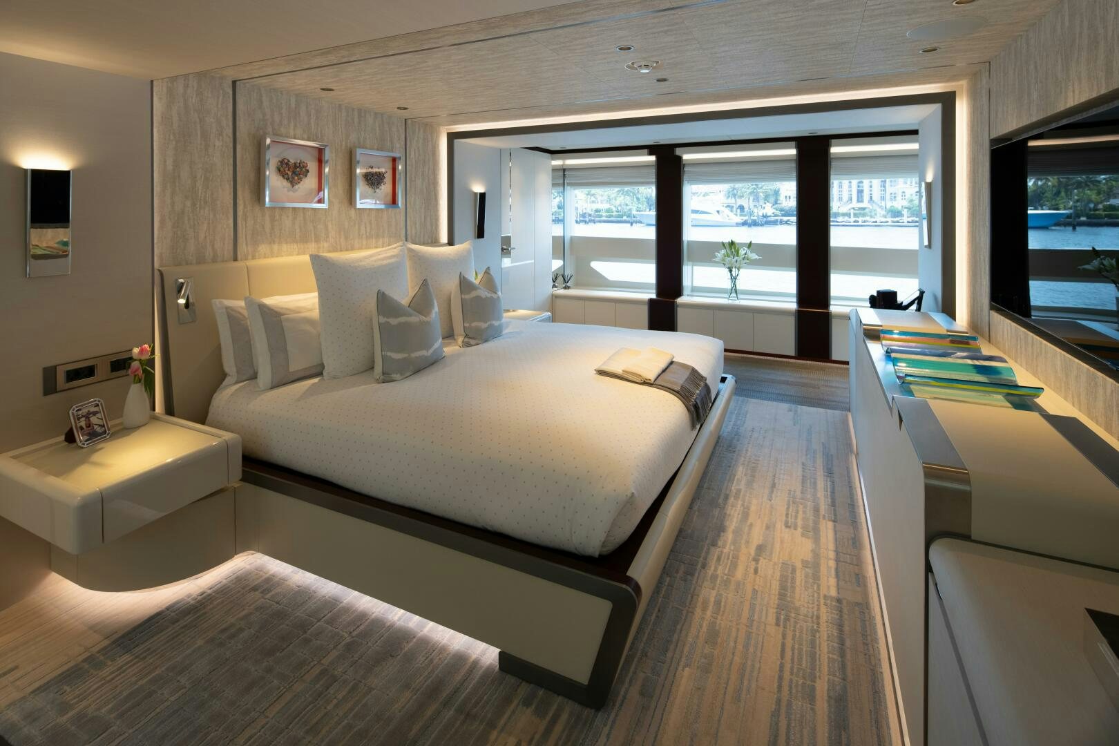 a room with a bed and a window aboard BOOK ENDS Yacht for Sale