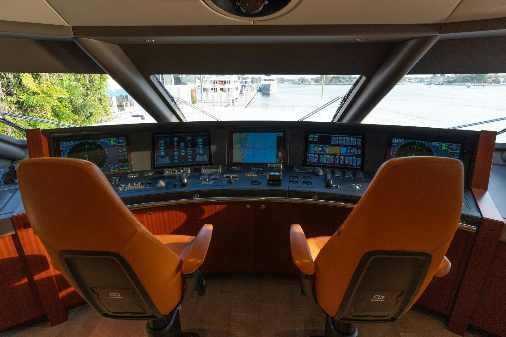 inside of a vehicle with seats and screens aboard BOOK ENDS Yacht for Sale