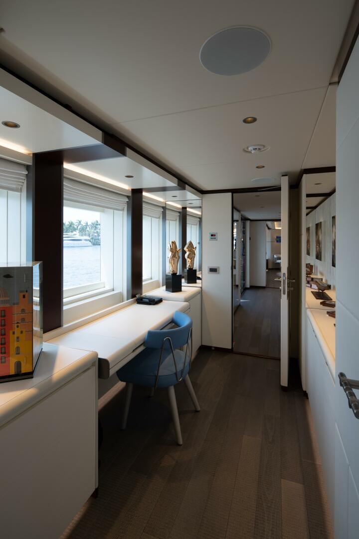 a room with a desk and chairs aboard BOOK ENDS Yacht for Sale
