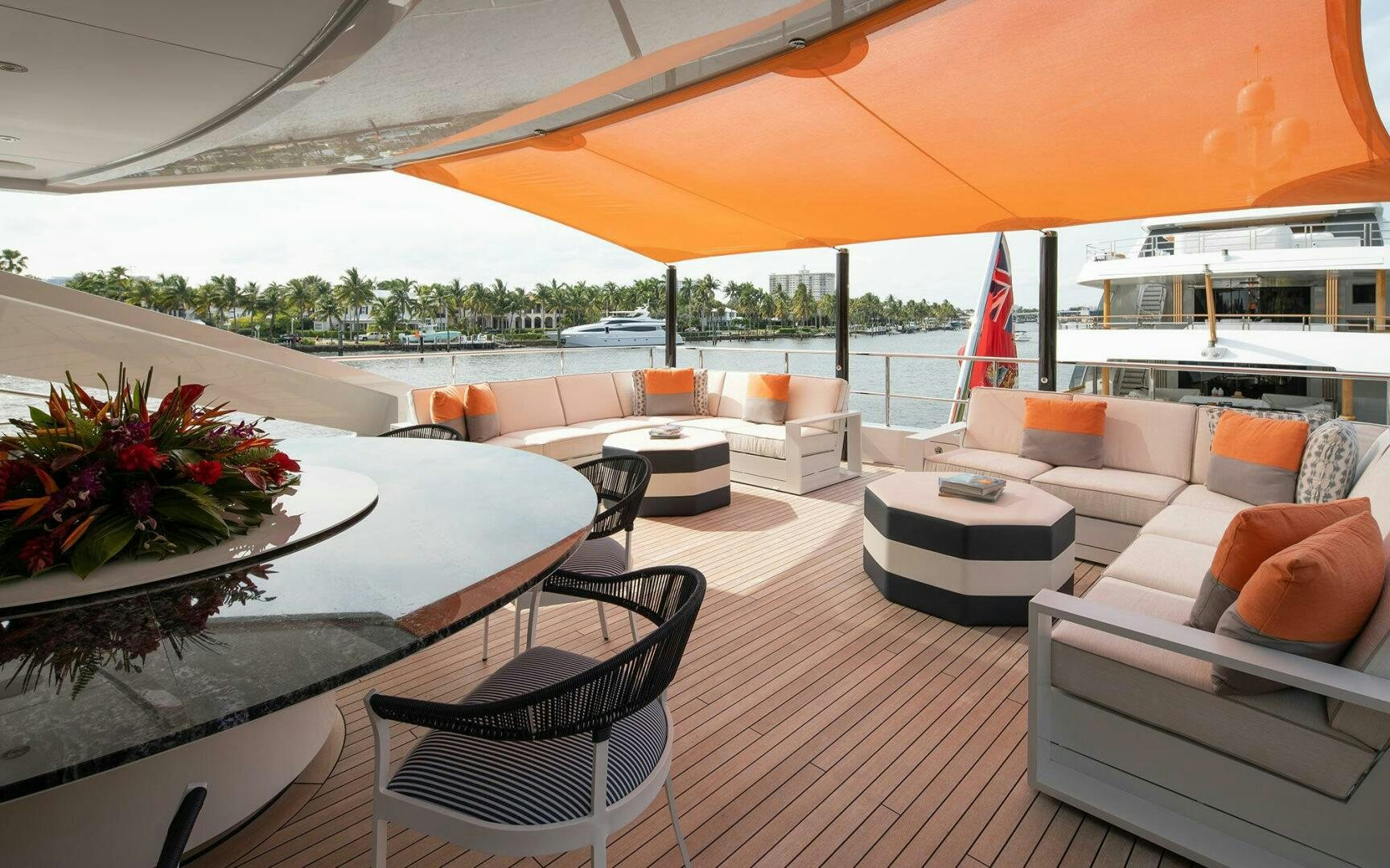 a large open living room with a large umbrella aboard BOOK ENDS Yacht for Sale
