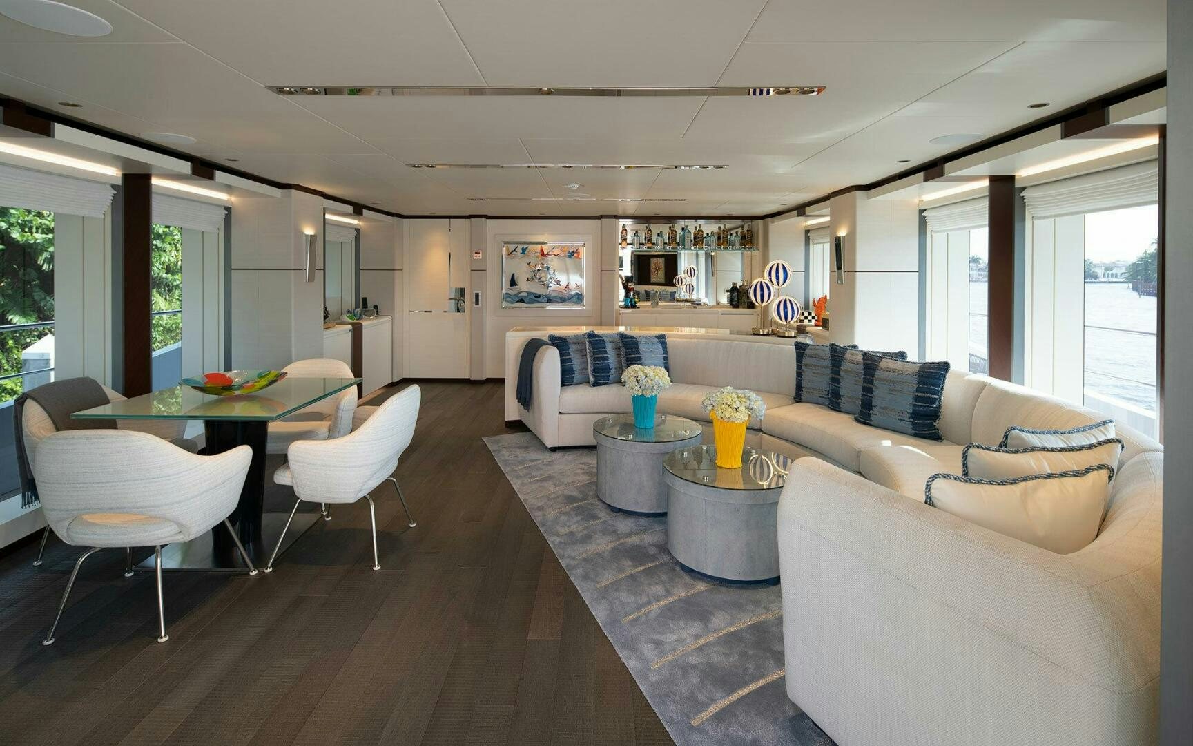 a living room with a table and chairs aboard BOOK ENDS Yacht for Sale