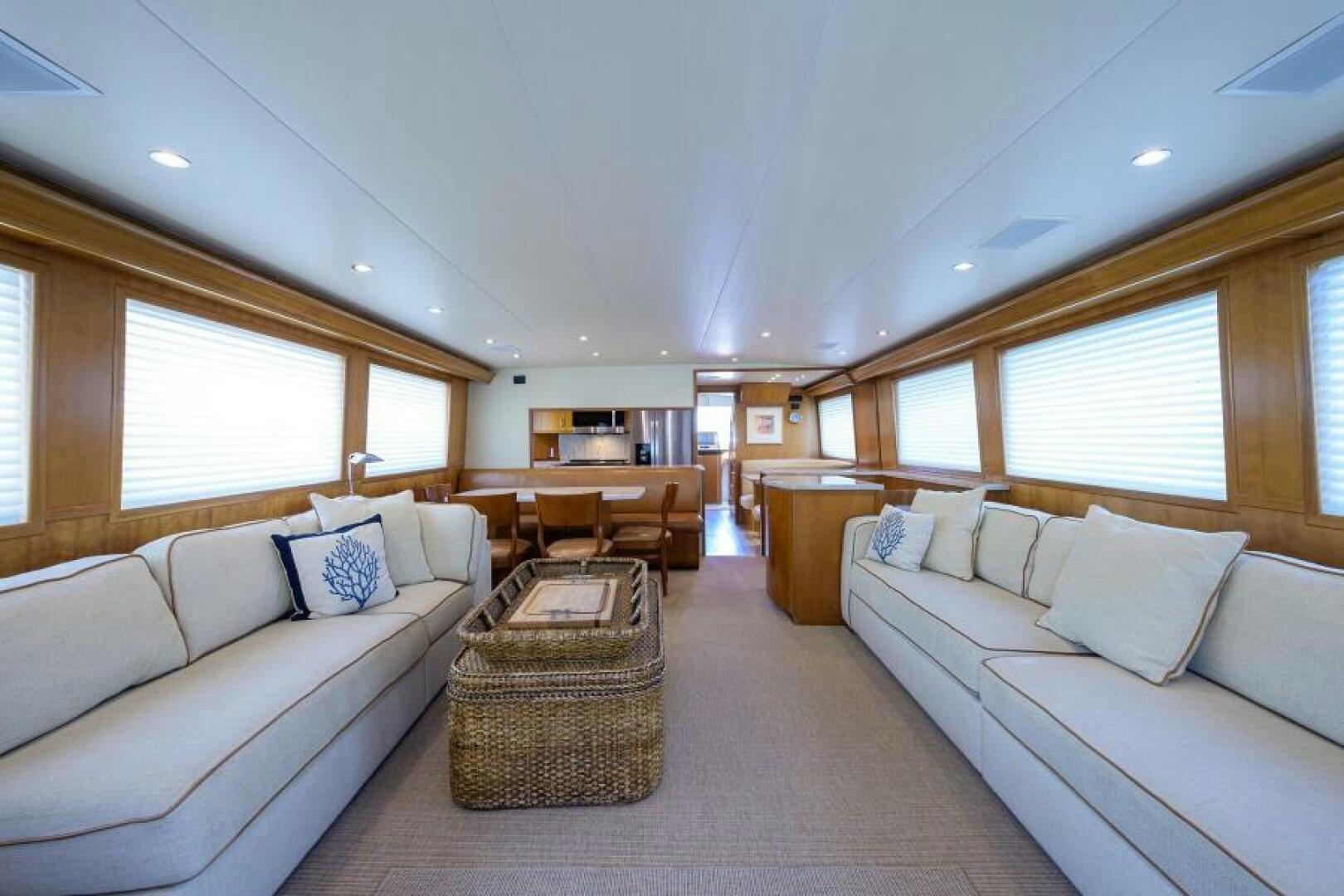 a living room with a couch and a table aboard BELLAGIO Yacht for Sale