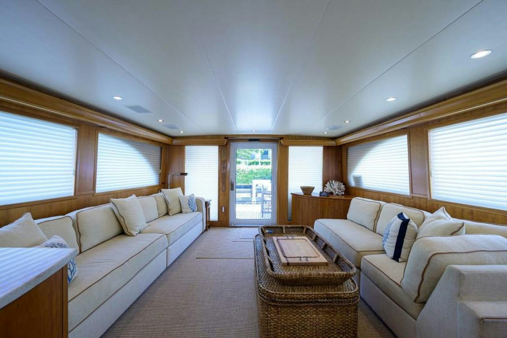 a living room with a couch and a table aboard BELLAGIO Yacht for Sale
