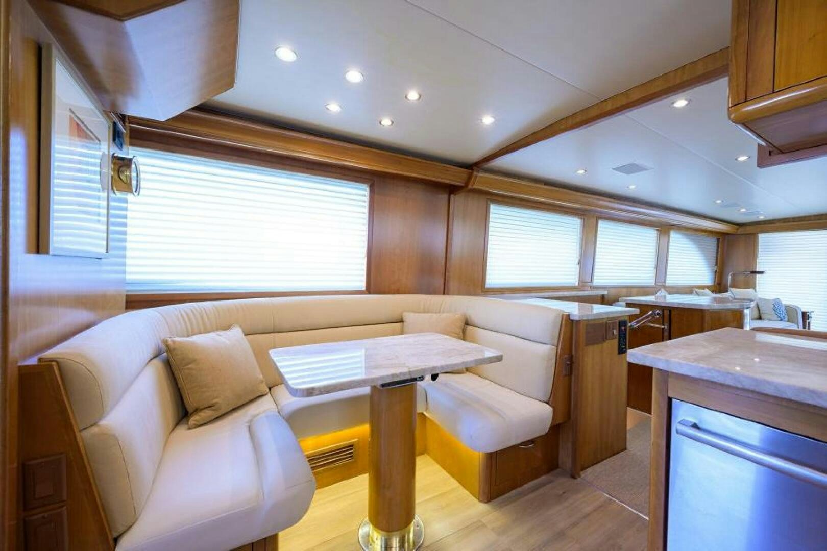 a room with a table and chairs aboard BELLAGIO Yacht for Sale