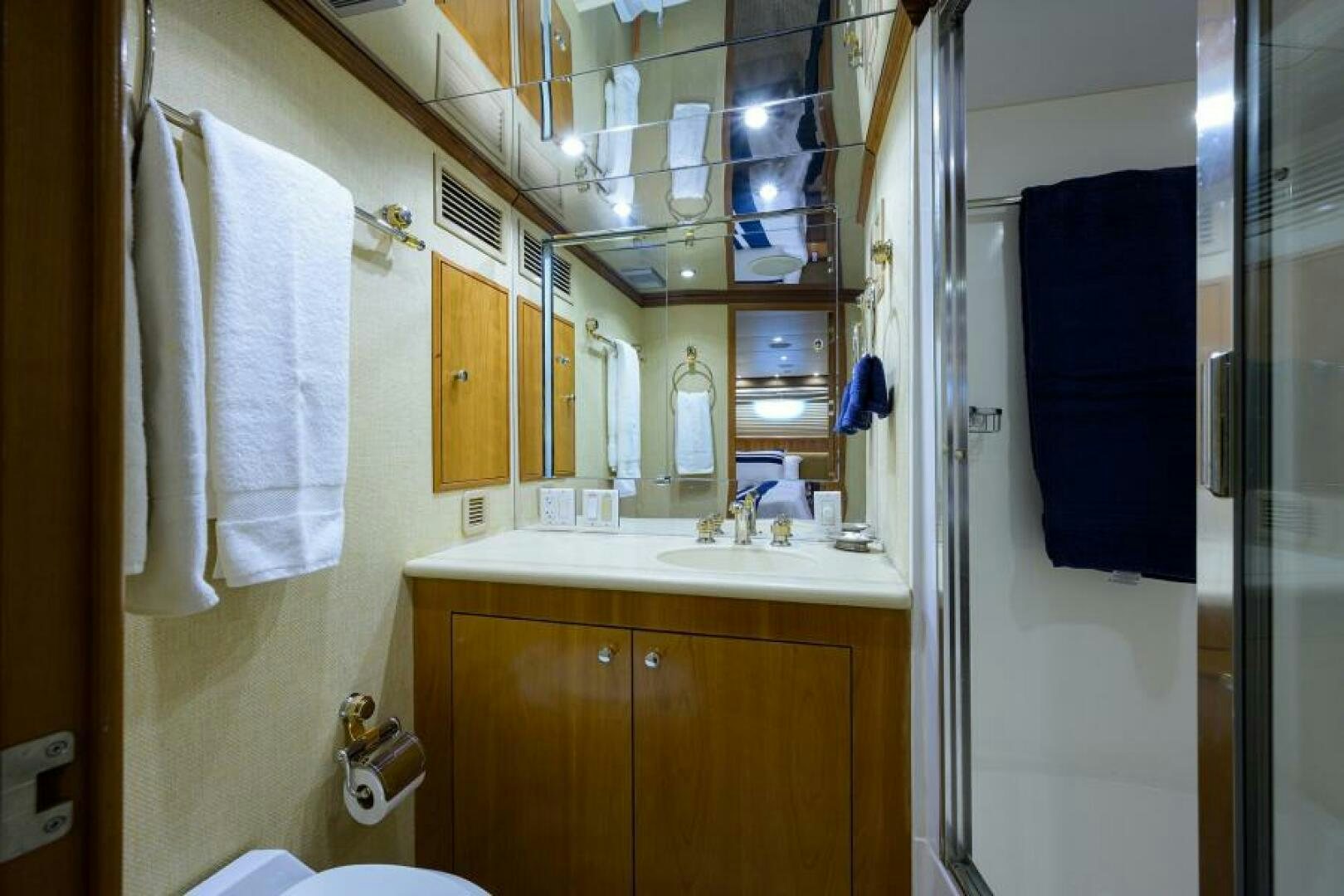 a bathroom with a sink and a mirror aboard BELLAGIO Yacht for Sale