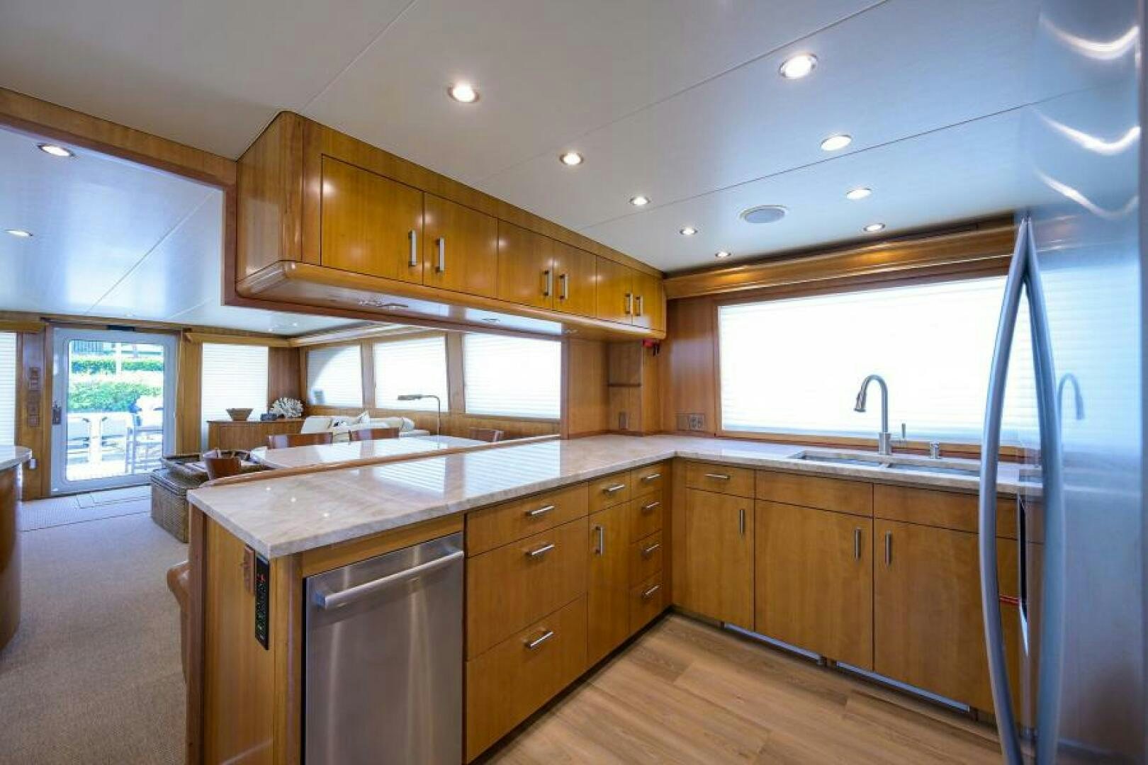 a large kitchen with wooden cabinets aboard BELLAGIO Yacht for Sale