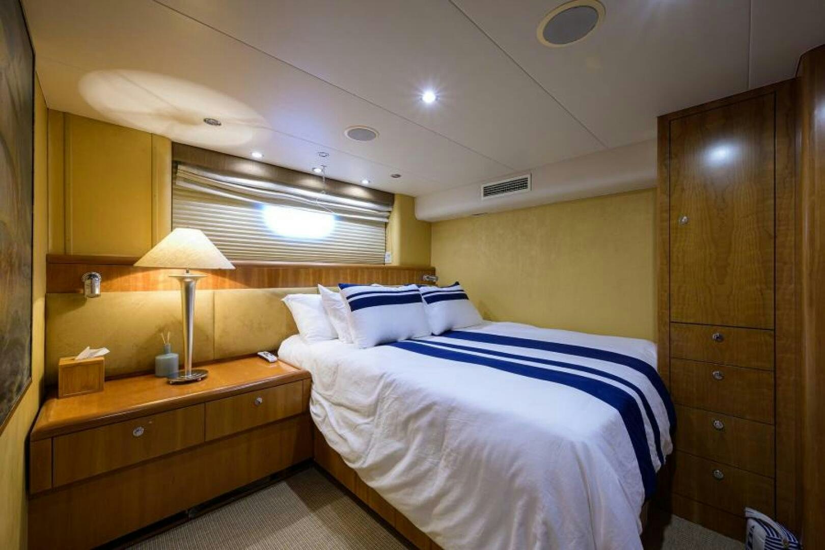 a bedroom with two beds aboard BELLAGIO Yacht for Sale