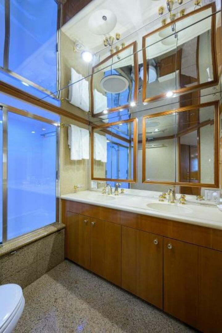 a bathroom with a large mirror aboard BELLAGIO Yacht for Sale