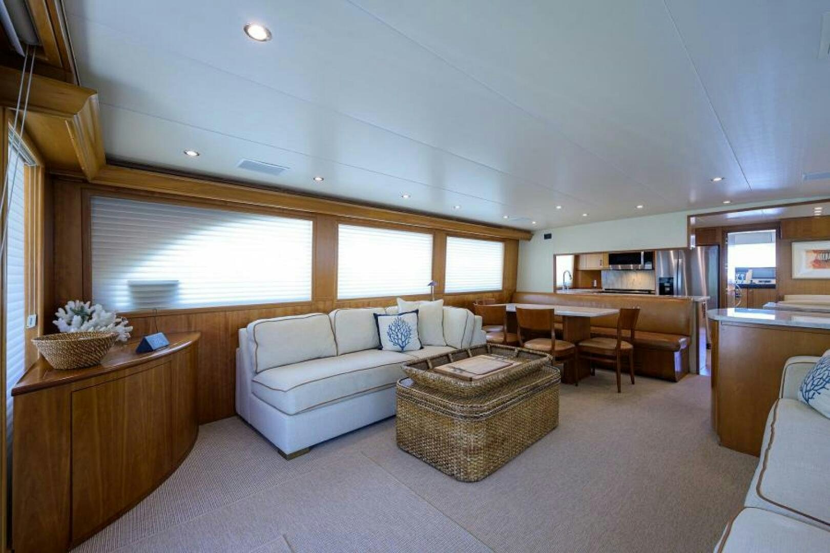 a living room with a couch and a table aboard BELLAGIO Yacht for Sale