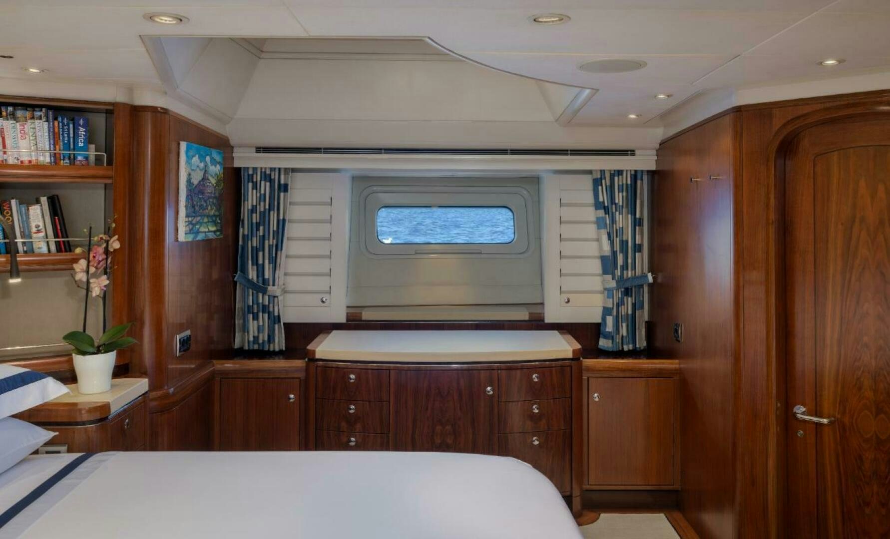 a room with a bed and a television aboard ANTARES Yacht for Sale