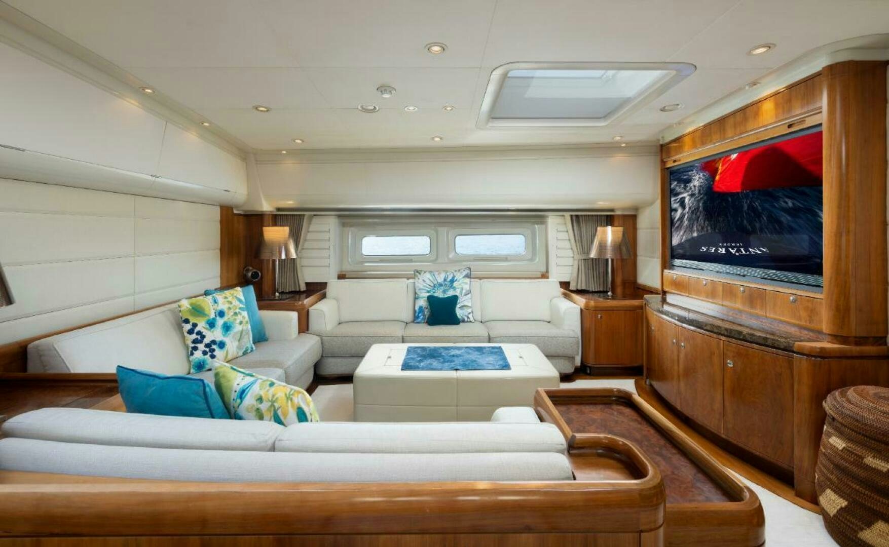 a living room with a large television aboard ANTARES Yacht for Sale