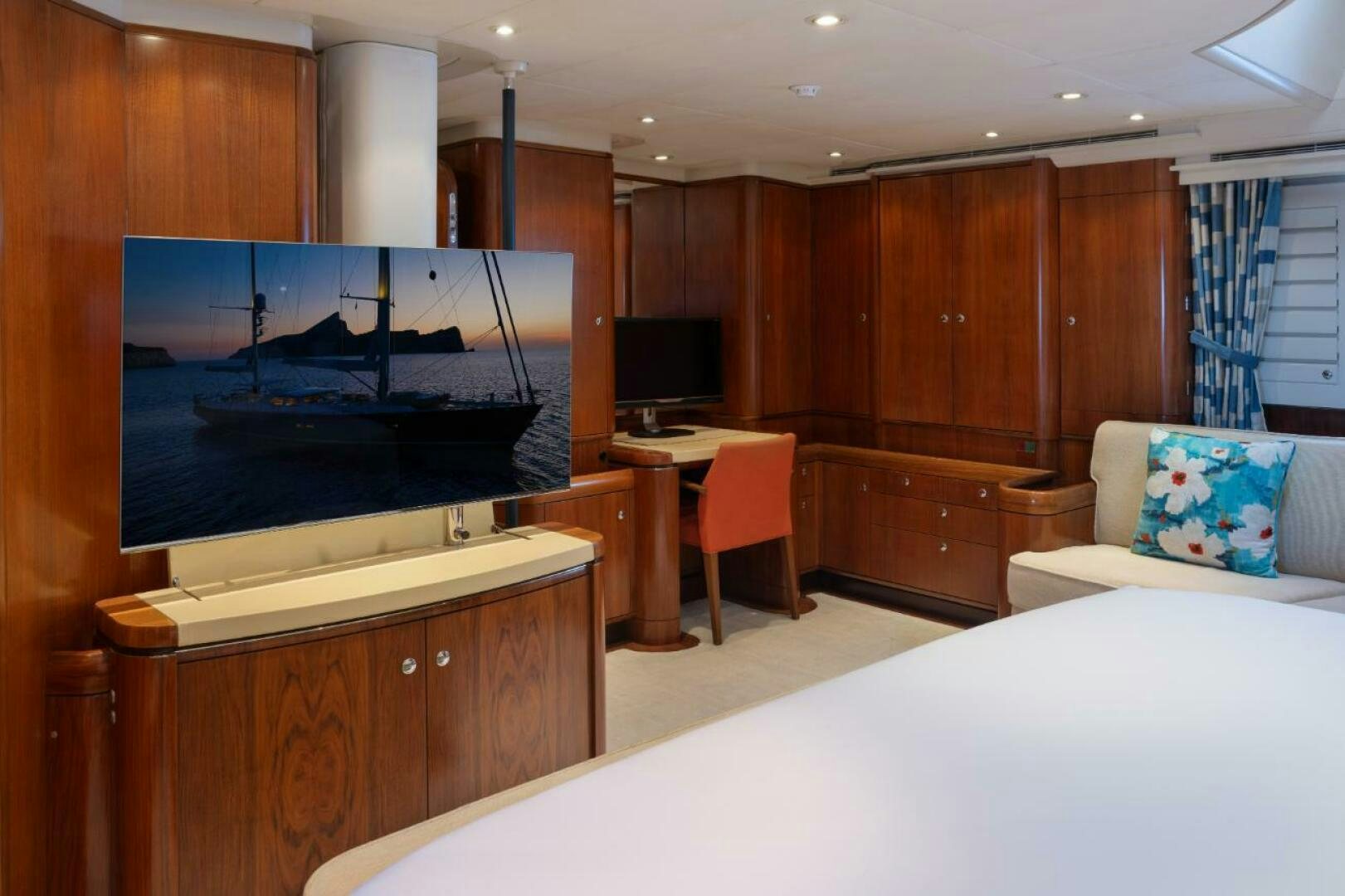 a room with a tv and a bed aboard ANTARES Yacht for Sale