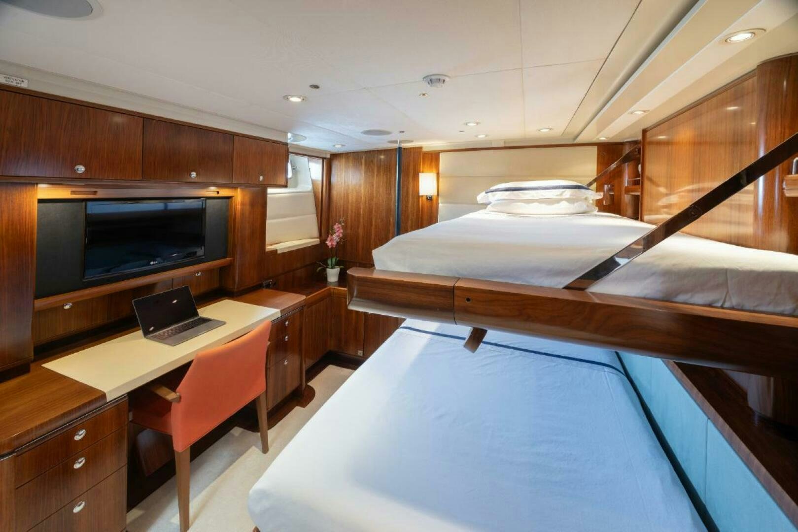 a room with a bed and a desk aboard ANTARES Yacht for Sale