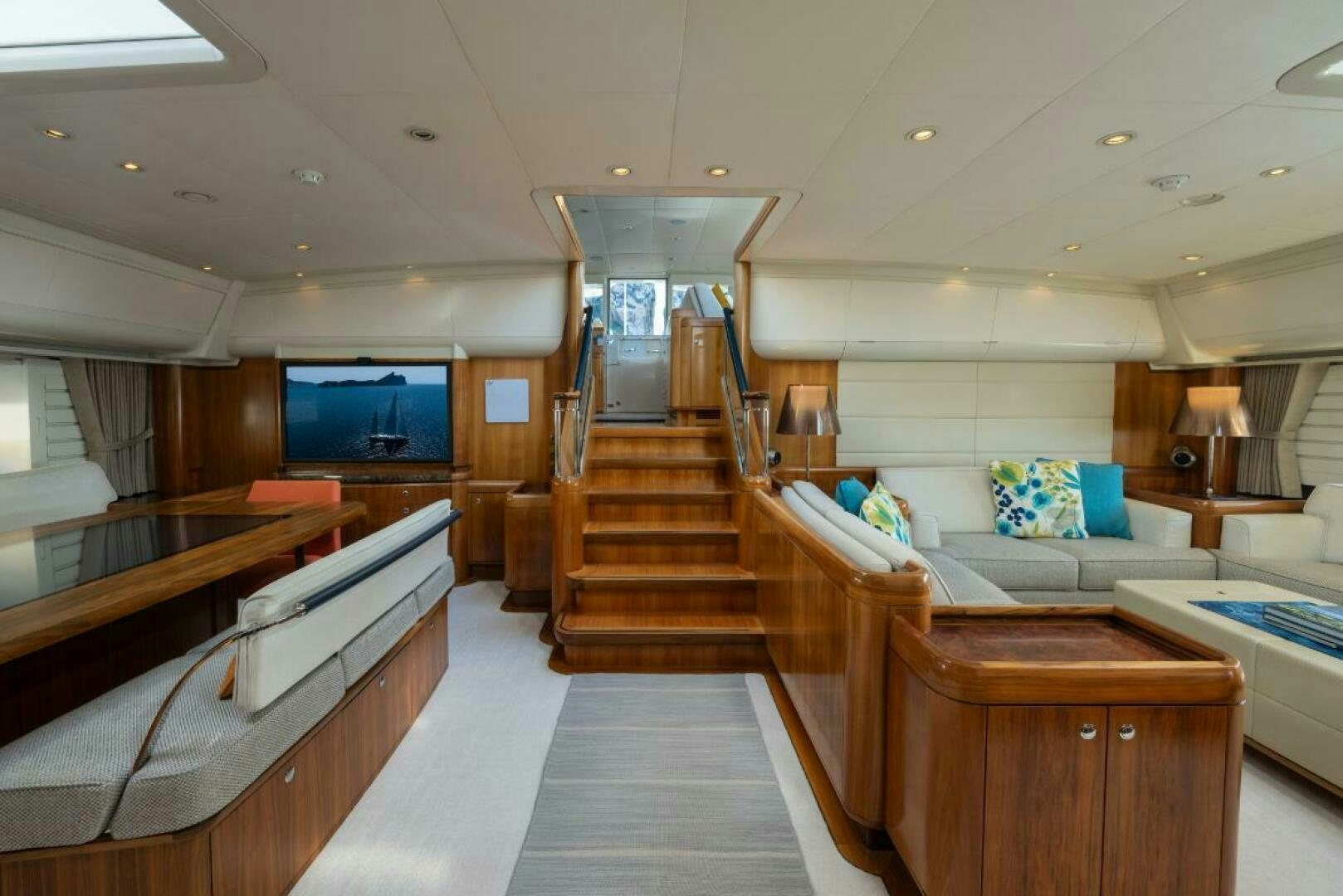 a room with a bed and a couch aboard ANTARES Yacht for Sale