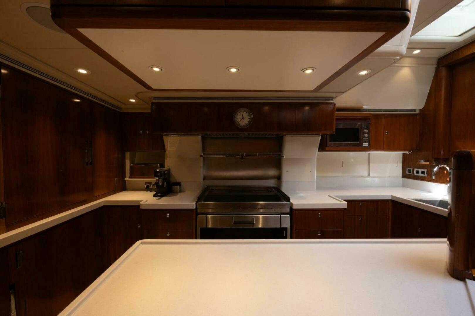 a kitchen with a stove and cabinets aboard ANTARES Yacht for Sale