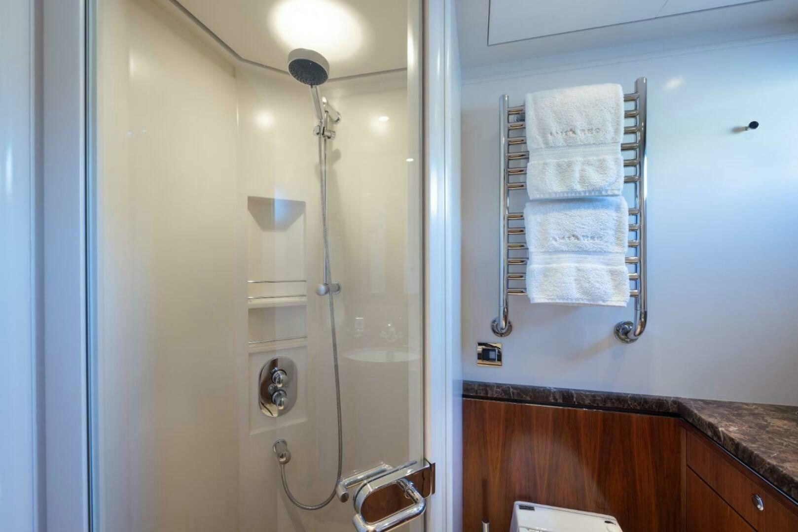 a shower with a towel on the wall aboard ANTARES Yacht for Sale