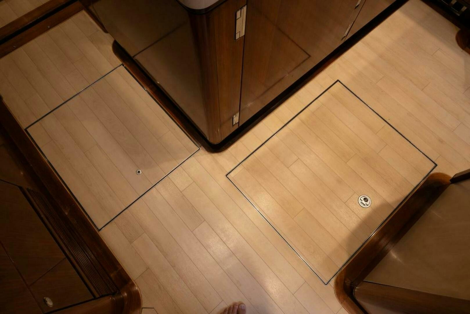 a wooden floor with wooden cabinets aboard ANTARES Yacht for Sale