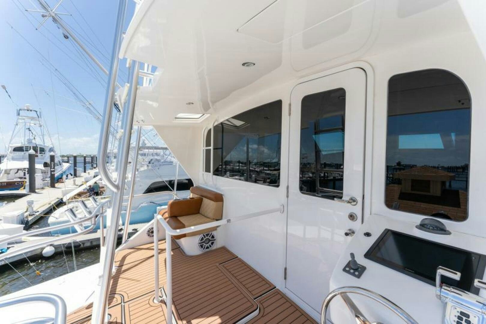 a boat with a bench and a chair on it aboard SALT STRUK Yacht for Sale