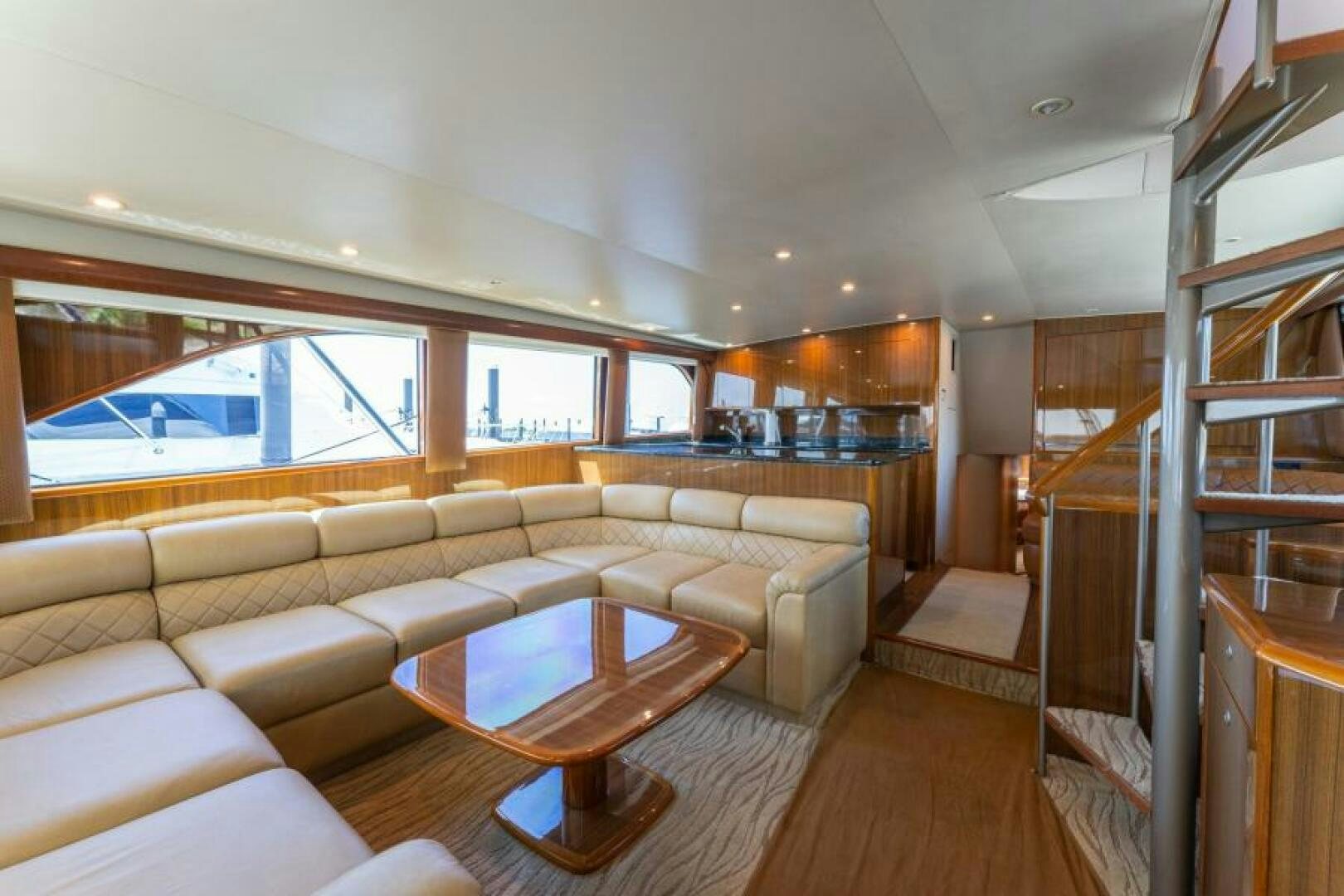 a living room with a large window aboard SALT STRUK Yacht for Sale