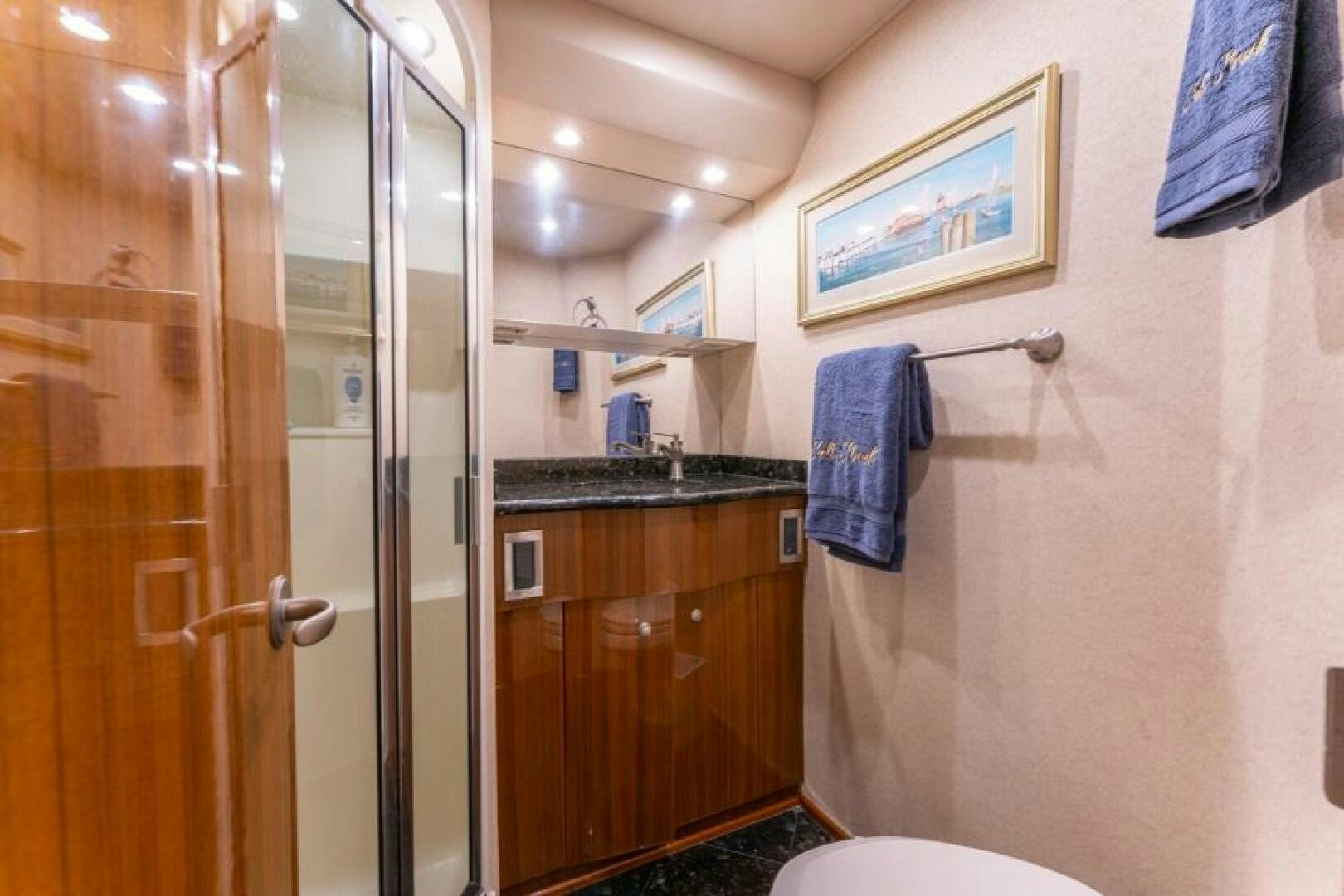 a bathroom with a shower unit and sink aboard SALT STRUK Yacht for Sale